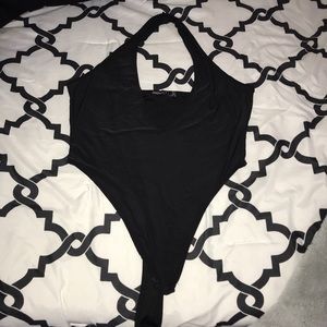 Deep V-neck cut , halter body suit